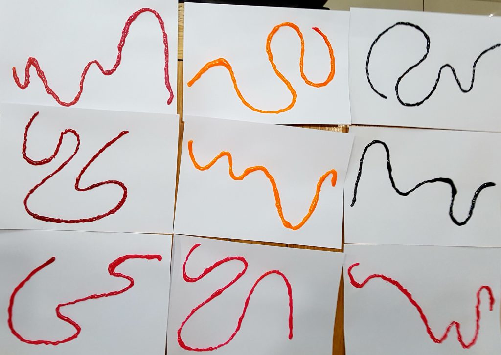 Pitch sirening activity - if you're handy with a hot glue gun, these coloured glue squiggles are very satisfying to trace and vocalise.