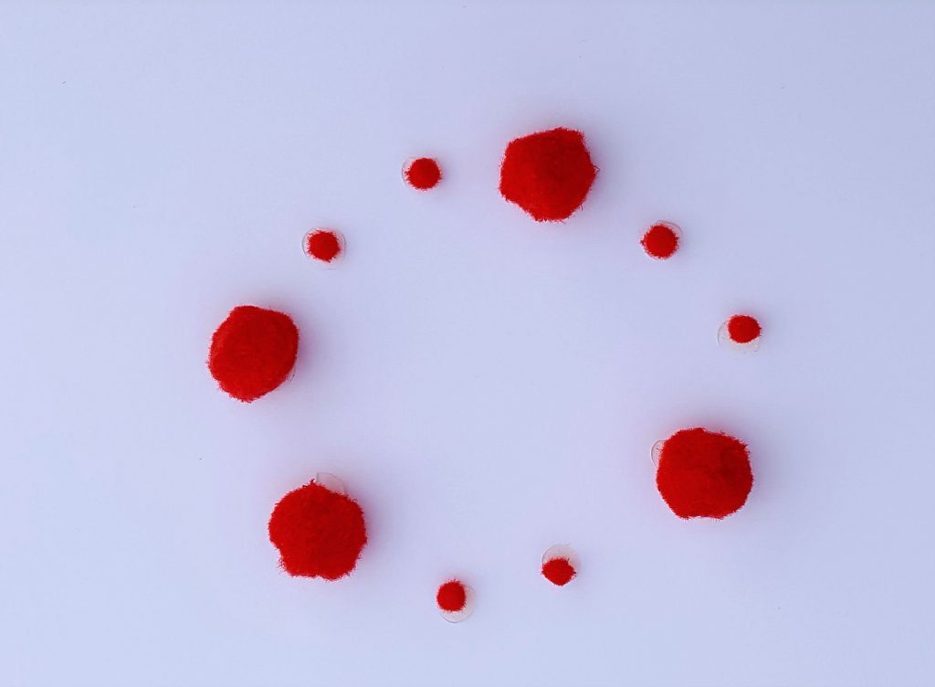 A graphic score made using pom-poms